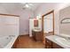 Large bathroom with double vanity and soaking tub at 796 Marion Beavers Rd, Sharpsburg, GA 30277