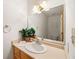 Clean bathroom with light wood vanity and updated sink at 796 Marion Beavers Rd, Sharpsburg, GA 30277