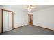 Bright bedroom with carpet flooring, double door closet, and access to hallway at 796 Marion Beavers Rd, Sharpsburg, GA 30277