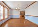 Hardwood floors, chandelier, and kitchen views at 796 Marion Beavers Rd, Sharpsburg, GA 30277