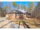 Brick home with a large driveway and wooded backyard at 796 Marion Beavers Rd, Sharpsburg, GA 30277