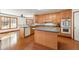 Eat-in kitchen with island, wood cabinets and sunny breakfast nook at 796 Marion Beavers Rd, Sharpsburg, GA 30277