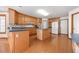 Spacious kitchen with an island and wood cabinets at 796 Marion Beavers Rd, Sharpsburg, GA 30277