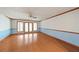 Spacious living room featuring hardwood floors and French doors at 796 Marion Beavers Rd, Sharpsburg, GA 30277