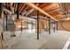 Unfinished basement with exposed beams, concrete floor, and storage area at 796 Marion Beavers Rd, Sharpsburg, GA 30277