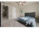 Bedroom featuring a ceiling fan, carpet floors, and one bed at 2481 Lake Erma Dr, Hampton, GA 30228