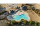 An aerial view of the community pool, surrounded by ample seating and lush landscaping at 2481 Lake Erma Dr, Hampton, GA 30228