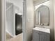 Modern powder room with updated vanity and stylish mirror at 2777 Northwood Sw Ct, Marietta, GA 30060