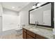 Updated bathroom with granite countertop, white tub, and modern fixtures at 2777 Northwood Sw Ct, Marietta, GA 30060