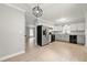 Open-concept kitchen featuring updated appliances and adjacent living space at 2777 Northwood Sw Ct, Marietta, GA 30060