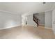 Open living room with hardwood floors and staircase access at 2777 Northwood Sw Ct, Marietta, GA 30060