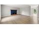 Spacious living room featuring a brick fireplace and light hardwood floors at 2777 Northwood Sw Ct, Marietta, GA 30060