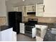 Modern kitchen with stainless steel appliances, stylish backsplash, and plenty of storage space at 683 Wood Path Ct, Stone Mountain, GA 30083