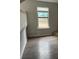 Bright living room featuring hardwood floors, large windows for natural light at 683 Wood Path Ct, Stone Mountain, GA 30083
