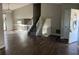 Open living area with hardwood floors, staircase, and natural light streaming through the windows at 683 Wood Path Ct, Stone Mountain, GA 30083