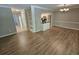 Open-concept dining room with hardwood floors and stylish lighting fixture at 738 Brentwood Pl, Marietta, GA 30067