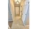 Bright hallway featuring tile flooring, white trim, and a white front door at 738 Brentwood Pl, Marietta, GA 30067