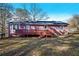 House with a wooden deck and a spacious backyard at 1005 Quail Dr, Stockbridge, GA 30281