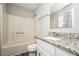 Bathroom with granite countertop and a shower/tub combo at 1005 Quail Dr, Stockbridge, GA 30281