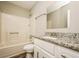 Bathroom with granite countertop and shower/tub combo at 1005 Quail Dr, Stockbridge, GA 30281