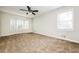 Bright bedroom with bay window and ceiling fan at 1005 Quail Dr, Stockbridge, GA 30281