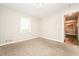 Bright bedroom with neutral walls and carpet flooring at 1005 Quail Dr, Stockbridge, GA 30281