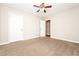 Large bedroom with ceiling fan and neutral decor at 1005 Quail Dr, Stockbridge, GA 30281