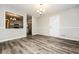 Comfortable dining room featuring hardwood floors and white trim provides an inviting space for meals and gatherings at 1005 Quail Dr, Stockbridge, GA 30281