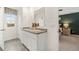 Bathroom featuring double vanity, framed mirror, natural light, and view of the bedroom at 353 Sound Cir, Stockbridge, GA 30281