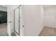 Bathroom featuring walk-in shower with a glass door, tile flooring and access to a walk-in closet at 353 Sound Cir, Stockbridge, GA 30281