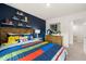 Bright bedroom with a vibrant color palette and built-in shelving for showcasing decor at 353 Sound Cir, Stockbridge, GA 30281