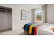 Cozy bedroom featuring a comfortable bed, neutral tones, and closet for ample storage at 353 Sound Cir, Stockbridge, GA 30281