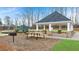 Community picnic shelter with stone columns, picnic tables, and barbecue grill at 353 Sound Cir, Stockbridge, GA 30281