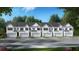 New townhome community featuring traditional architectural details and attached garages at 353 Sound Cir, Stockbridge, GA 30281