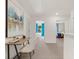Bright hallway with desk space and views into bedrooms offering an inviting and functional transition between spaces at 353 Sound Cir, Stockbridge, GA 30281