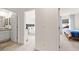 Hallway with a bathroom and bedroom view, providing a seamless transition between the private spaces of the house at 353 Sound Cir, Stockbridge, GA 30281