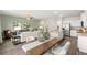 Spacious living area with an open layout, seamlessly connecting the kitchen and dining space for easy living at 353 Sound Cir, Stockbridge, GA 30281