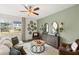 Inviting living room with ample natural light, complemented by tasteful decor and comfortable seating arrangements at 353 Sound Cir, Stockbridge, GA 30281