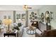 Comfortable living room with large windows, stylish furnishings, and plenty of space for relaxation and gatherings at 353 Sound Cir, Stockbridge, GA 30281