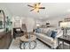Bright living room with modern decor, seamlessly connected to the kitchen and dining area for convenient living at 353 Sound Cir, Stockbridge, GA 30281