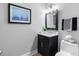 Simple bathroom with dark vanity and updated fixtures at 135 River Point Ct, Alpharetta, GA 30022