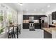 Modern kitchen with stainless steel appliances and granite countertops at 135 River Point Ct, Alpharetta, GA 30022