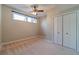 Basement bedroom with ceiling fan and closet at 2612 Cliffview Dr, Lilburn, GA 30047