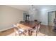 Bright dining room with hardwood floors and a crystal chandelier at 2612 Cliffview Dr, Lilburn, GA 30047