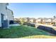 Backyard view showcasing a well-maintained lawn, a patio area, and a privacy fence at 264 Magnaview Dr, Mcdonough, GA 30253