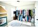 Bright bedroom with clothing rack, dollhouse and a window providing natural light at 264 Magnaview Dr, Mcdonough, GA 30253