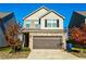Two-story house with a two-car garage and basketball hoop at 264 Magnaview Dr, Mcdonough, GA 30253