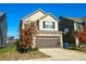 Two-story house with a two-car garage and basketball hoop at 264 Magnaview Dr, Mcdonough, GA 30253