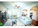 Living room with hardwood floors, ceiling fan and view into kitchen at 264 Magnaview Dr, Mcdonough, GA 30253