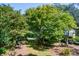 Mature trees and landscaped yard at 5154 Central Dr, Stone Mountain, GA 30083